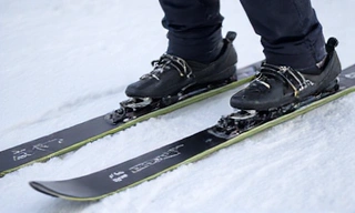 Detailed close-up of ski bindings on skis